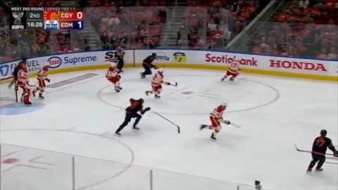 Leon Draisaitl backchecks, tracks, and forces dump in